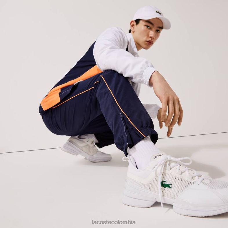 chándal deportivo con bloques de color y marca blanco/azul marino/naranja Lacoste ropa hombres 80XZX1156