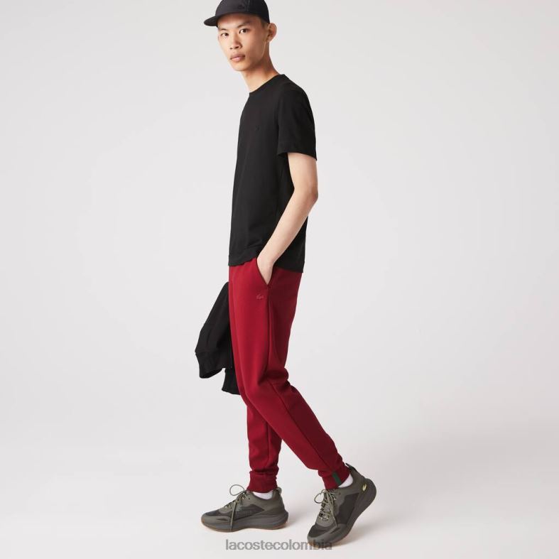 pantalones de chándal de corte slim en mezcla de algodón jaspeado Burdeos Lacoste ropa hombres 80XZX1007